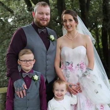 Hannah after Bell's palsy recovery at her wedding with her husband and children