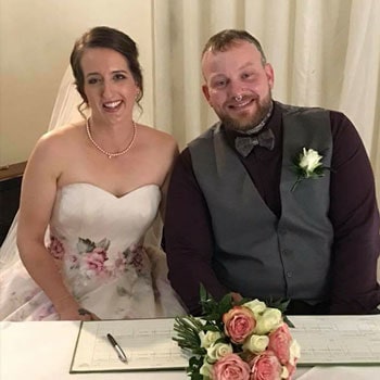 Hannah after Bell's palsy recovery at her wedding with her husband